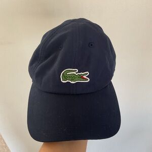 Lacoste sport navy blue cap with iconic green crocodile. One size fits all..